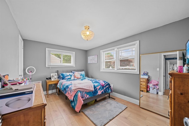 36 Peck St, Haverstraw, NY 10993 - bedroom with multiple windows, light wood-style floors, and baseboards