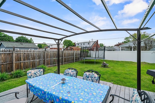 36 Peck St, Haverstraw, NY 10993 - view of patio / terrace with outdoor dining space, a pergola, a trampoline, and a wooden deck