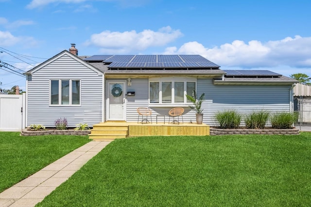 64 W Granada Ave, Lindenhurst, NY 11757 - single story home featuring solar panels and a chimney