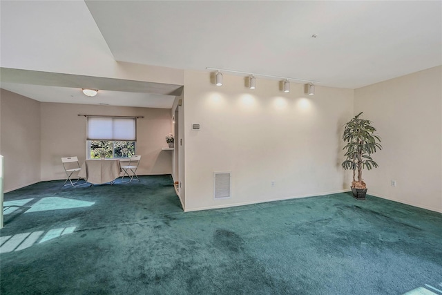 35 Gibbs Rd Unit 39, Coram, NY 11727 - carpeted spare room featuring rail lighting and baseboards