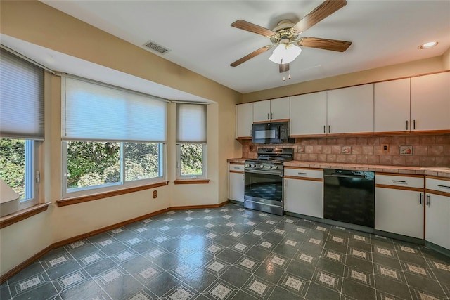 35 Gibbs Rd Unit 39, Coram, NY 11727 - kitchen with black appliances, backsplash, white cabinetry, and baseboards