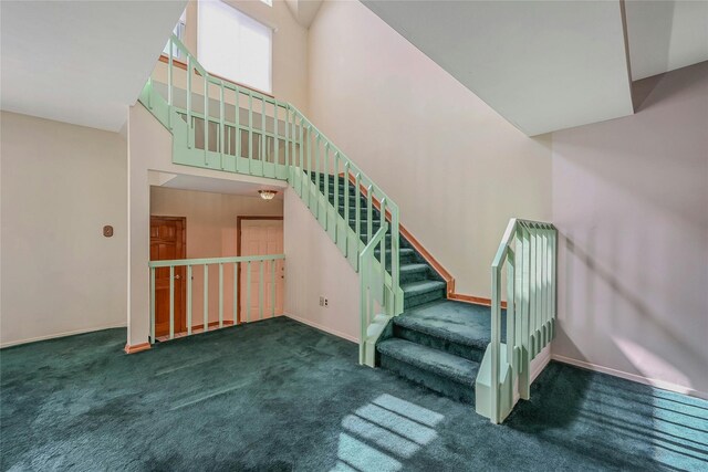 35 Gibbs Rd Unit 39, Coram, NY 11727 - stairway with carpet, a towering ceiling, and baseboards