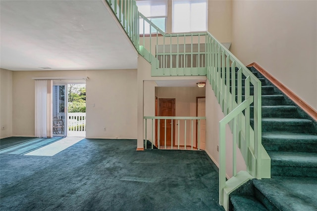 35 Gibbs Rd Unit 39, Coram, NY 11727 - unfurnished living room featuring carpet floors, stairs, and baseboards