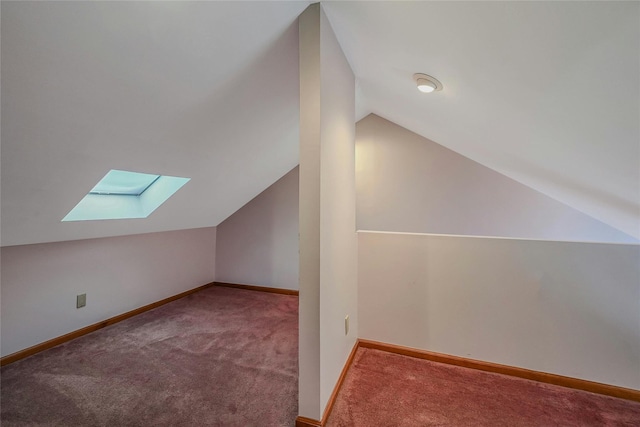 35 Gibbs Rd Unit 39, Coram, NY 11727 - additional living space with a skylight, carpet floors, vaulted ceiling, and baseboards