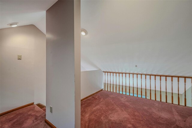 35 Gibbs Rd Unit 39, Coram, NY 11727 - corridor with carpet, vaulted ceiling, and baseboards