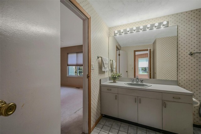 35 Gibbs Rd Unit 39, Coram, NY 11727 - bathroom with wallpapered walls, vanity, and tile patterned flooring