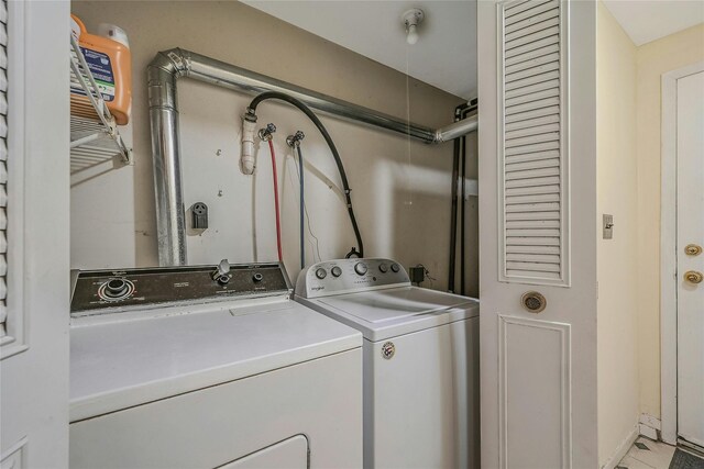 35 Gibbs Rd Unit 39, Coram, NY 11727 - laundry area featuring separate washer and dryer and baseboards