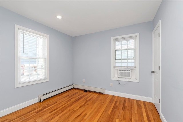44 Wyoming Ave, Long Beach, NY 11561 - unfurnished room featuring baseboard heating, light wood-type flooring, baseboards, recessed lighting, and cooling unit