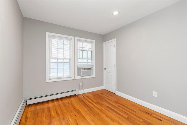 44 Wyoming Ave, Long Beach, NY 11561 - unfurnished room with a baseboard radiator, cooling unit, baseboards, light wood-style floors, and recessed lighting