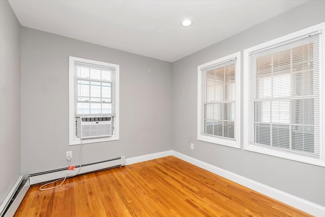 44 Wyoming Ave, Long Beach, NY 11561 - empty room featuring a baseboard heating unit, light wood-style flooring, baseboards, recessed lighting, and cooling unit