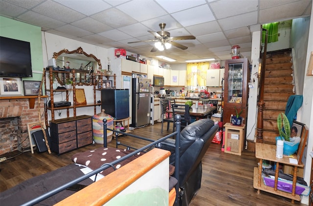 99 Pioneer St, Brooklyn, NY 11231 - office space with dark wood-style flooring, ceiling fan, a drop ceiling, and a brick fireplace