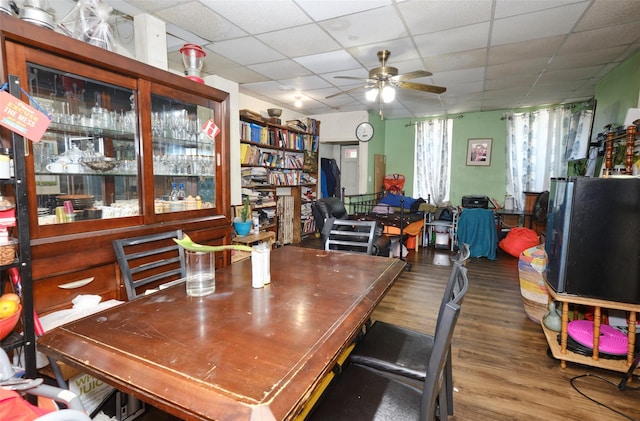 99 Pioneer St, Brooklyn, NY 11231 - dining room featuring a ceiling fan, wood finished floors, and a drop ceiling