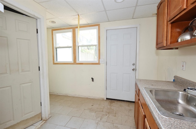 99 Pioneer St, Brooklyn, NY 11231 - kitchen with brown cabinets, a drop ceiling, light tile patterned floors, and open shelves