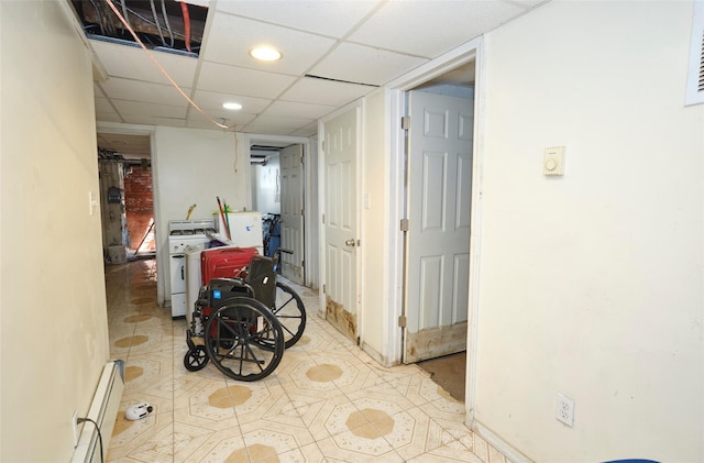 99 Pioneer St, Brooklyn, NY 11231 - hallway featuring recessed lighting, baseboard heating, a drop ceiling, and tile patterned floors