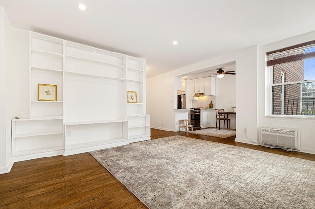 36 Hamilton Ave Unit 6S, Staten Island, NY 10301 - unfurnished living room featuring dark wood-style flooring, a wall unit AC, a ceiling fan, baseboards, and recessed lighting
