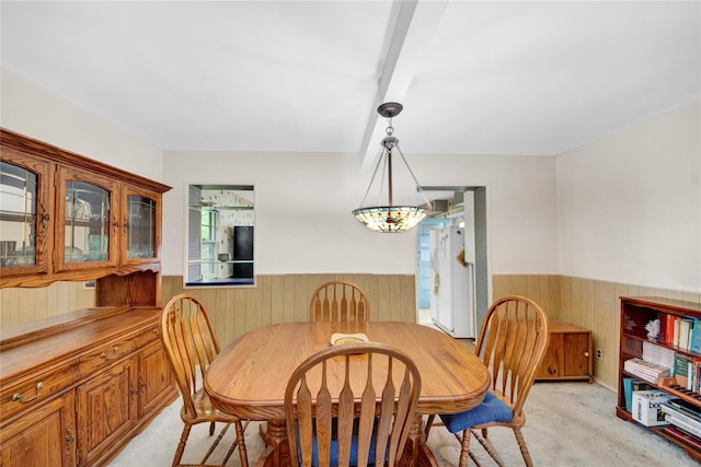 23 Lenox Pl, Freeport, NY 11520 - dining area with wainscoting, wood walls, and light colored carpet