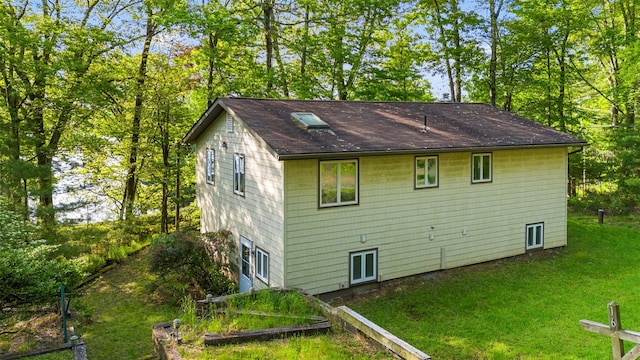 16 Fairway Dr, Eldred, NY 12743 - view of side of home with a lawn and roof with shingles