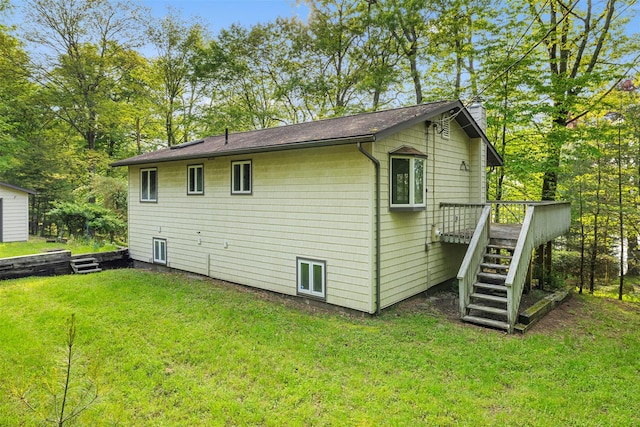 16 Fairway Dr, Eldred, NY 12743 - back of house with stairway, a deck, a lawn, and a chimney