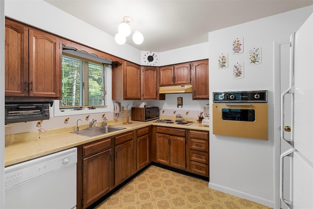 16 Fairway Dr, Eldred, NY 12743 - kitchen featuring white appliances, a sink, under cabinet range hood, and light countertops