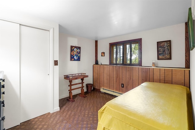 16 Fairway Dr, Eldred, NY 12743 - bedroom featuring baseboard heating, tile patterned floors, and a closet