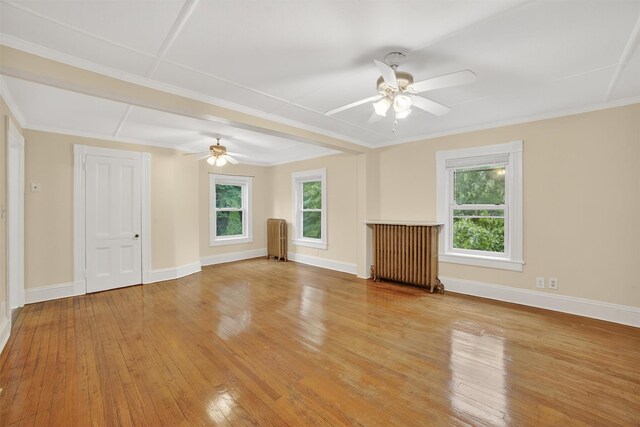 108 Union Ave, Peekskill, NY 10566 - unfurnished living room with radiator heating unit, a ceiling fan, plenty of natural light, light wood-style flooring, and ornamental molding