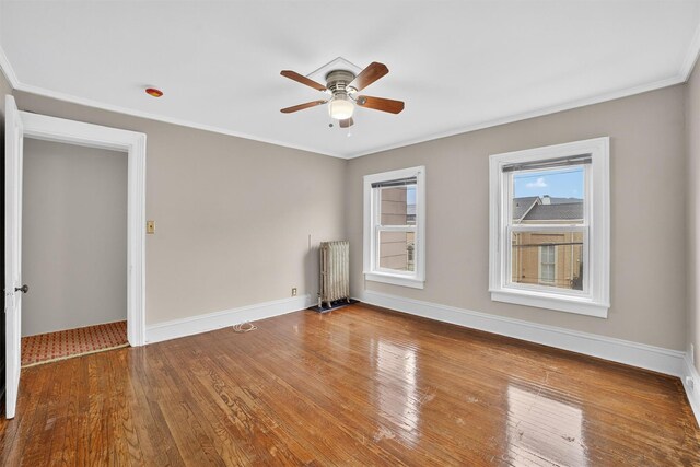 108 Union Ave, Peekskill, NY 10566 - empty room with radiator, a ceiling fan, wood finished floors, and crown molding