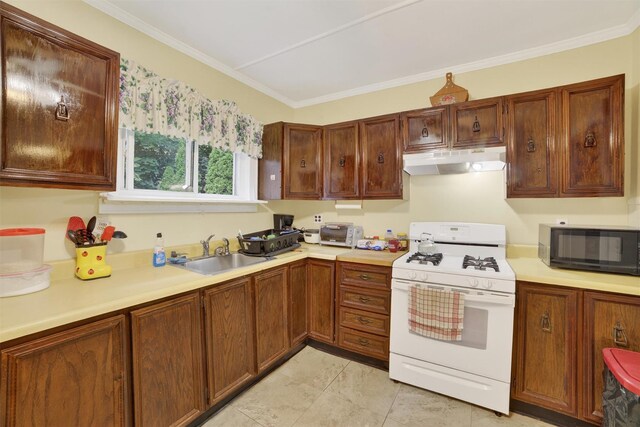 108 Union Ave, Peekskill, NY 10566 - kitchen with white gas range, under cabinet range hood, black microwave, light countertops, and crown molding