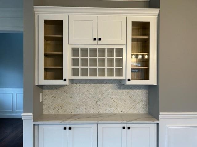 51 Michigan Ave, Massapequa, NY 11758 - bar area with backsplash, wainscoting, and a decorative wall