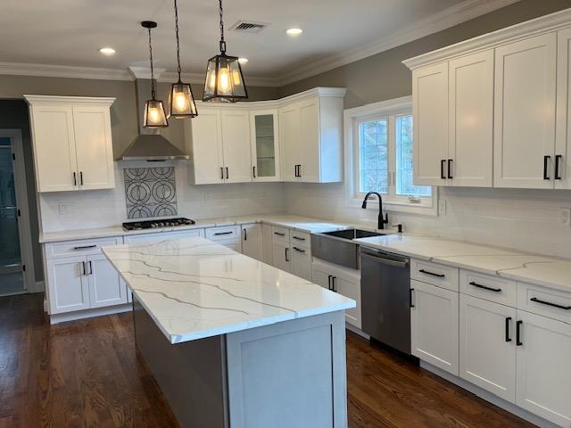 51 Michigan Ave, Massapequa, NY 11758 - kitchen with stainless steel dishwasher, gas stovetop, a center island, white cabinetry, and recessed lighting