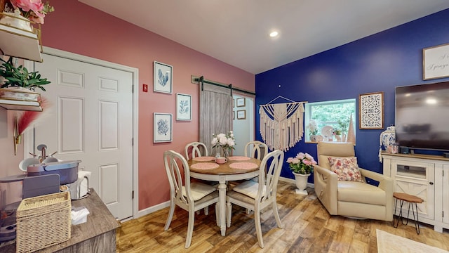 7 Didio Ln, Montgomery, NY 12549 - dining area with a barn door, wood finished floors, and recessed lighting
