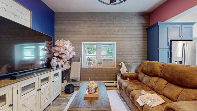 7 Didio Ln, Montgomery, NY 12549 - living area with wood walls, light wood-type flooring, and baseboard heating