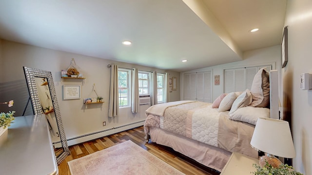 7 Didio Ln, Montgomery, NY 12549 - bedroom with baseboard heating, wood finished floors, multiple closets, and recessed lighting