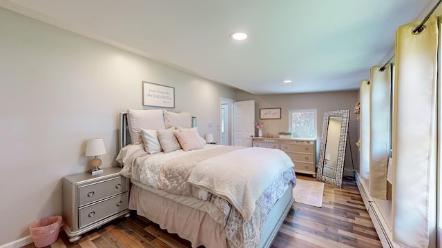 7 Didio Ln, Montgomery, NY 12549 - bedroom with dark wood-style floors, recessed lighting, and a baseboard heating unit