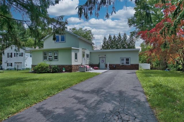 7 Didio Ln, Montgomery, NY 12549 - view of front of property featuring stucco siding, stone siding, driveway, and a front lawn