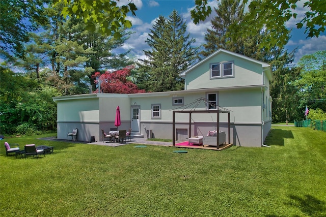 7 Didio Ln, Montgomery, NY 12549 - back of property with a patio area, a yard, a gazebo, stucco siding, and entry steps