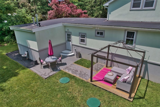 7 Didio Ln, Montgomery, NY 12549 - rear view of house with stucco siding, a yard, and a patio area
