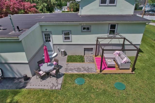 7 Didio Ln, Montgomery, NY 12549 - back of house with stucco siding and a yard