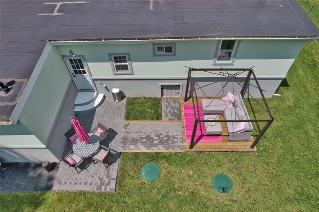 7 Didio Ln, Montgomery, NY 12549 - rear view of house featuring stucco siding and a lawn