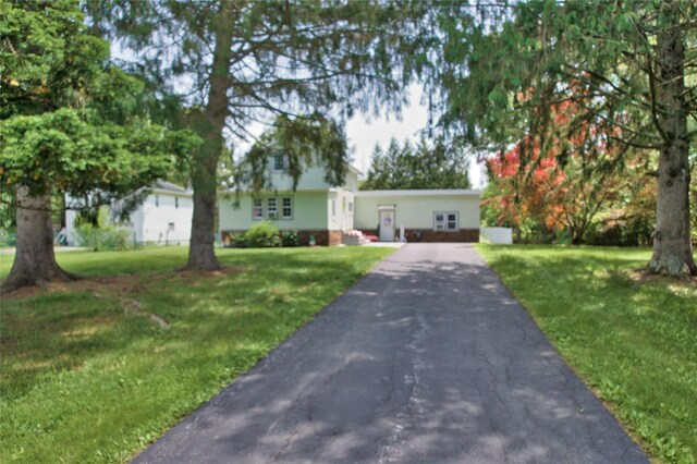 7 Didio Ln, Montgomery, NY 12549 - view of front of home with asphalt driveway and a front lawn