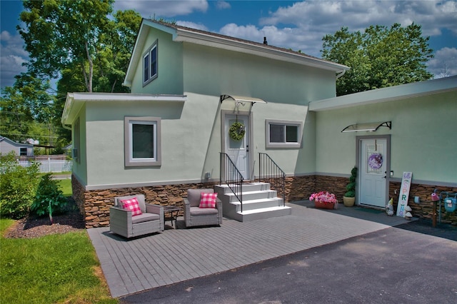 7 Didio Ln, Montgomery, NY 12549 - rear view of property featuring stone siding and stucco siding