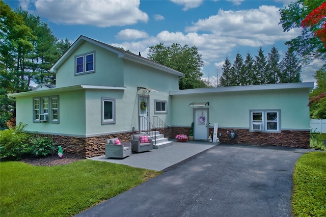 7 Didio Ln, Montgomery, NY 12549 - view of front of property with stucco siding, a front yard, and stone siding