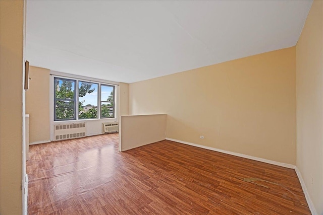 2015 St Paul Ave Unit 3G, Bronx, NY 10461 - unfurnished room with radiator, wood finished floors, and baseboards