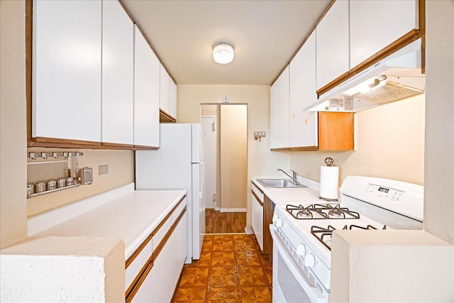 2015 St Paul Ave Unit 3G, Bronx, NY 10461 - kitchen with white appliances, a sink, under cabinet range hood, white cabinets, and light countertops