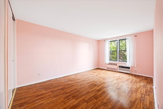 2015 St Paul Ave Unit 3G, Bronx, NY 10461 - spare room featuring radiator heating unit, wood finished floors, and baseboards