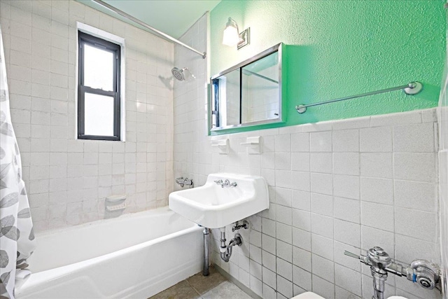2015 St Paul Ave Unit 3G, Bronx, NY 10461 - full bath with shower / bath combo with shower curtain, tile walls, tile patterned flooring, and a sink