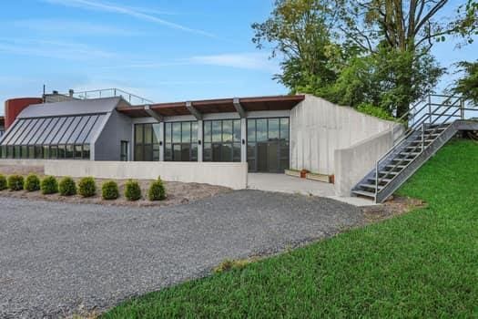 356 Bruyn Tpke, Wallkill, NY 12589 - back of property with a sunroom, stairway, and a lawn