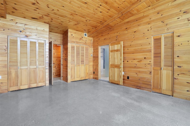 356 Bruyn Tpke, Wallkill, NY 12589 - unfurnished bedroom featuring wooden walls, wooden ceiling, and two closets