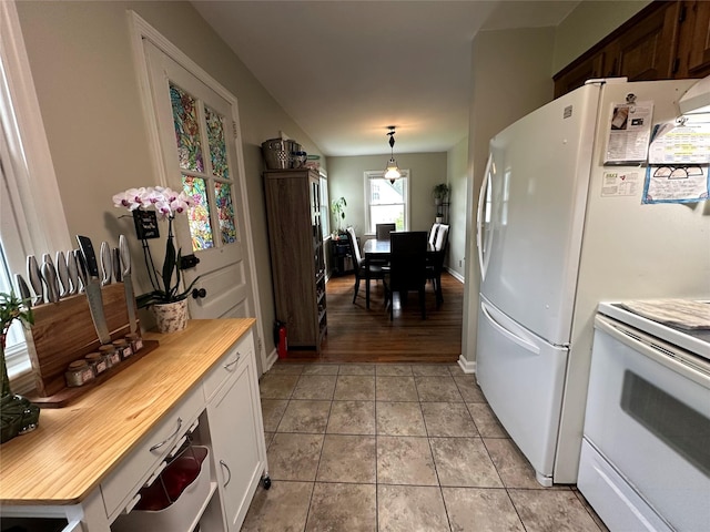 8 Spratt Ave, Poughkeepsie, NY 12603 - kitchen featuring white electric stove and light tile patterned floors
