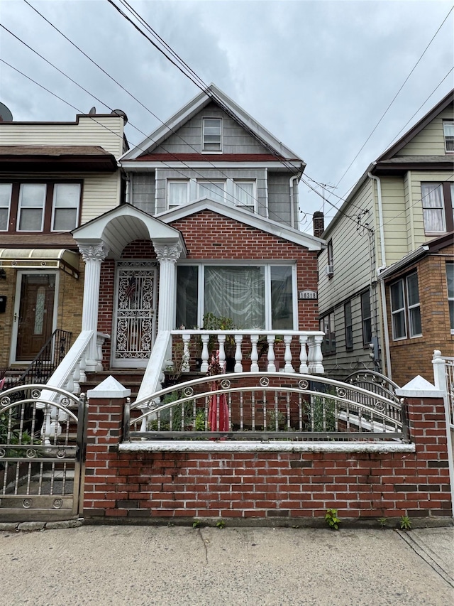 10318 115th St, Richmond Hill S, NY 11419 - view of front of property with a fenced front yard and brick siding