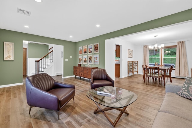11 Robin Hood Rd, Montebello, NY 10901 - living room featuring a chandelier, stairs, light wood finished floors, and recessed lighting
